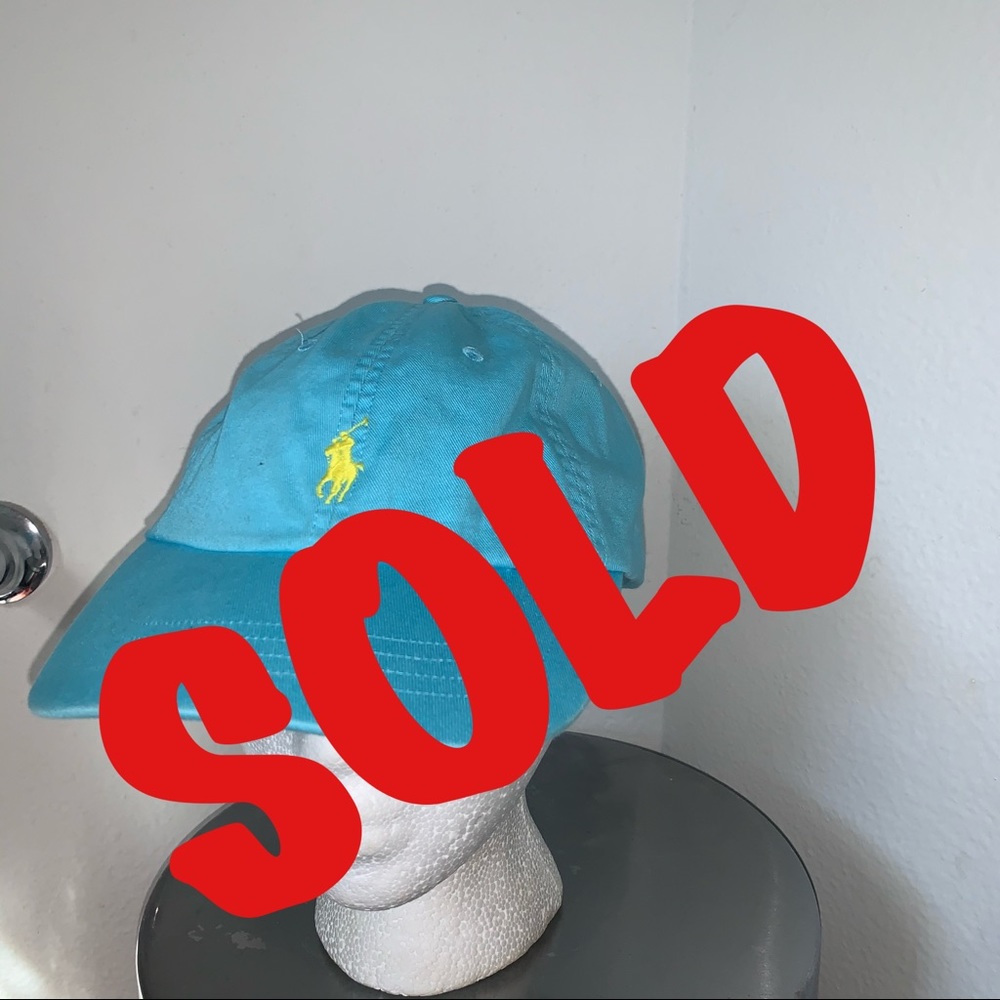Turquoise polo hat with yellow logo